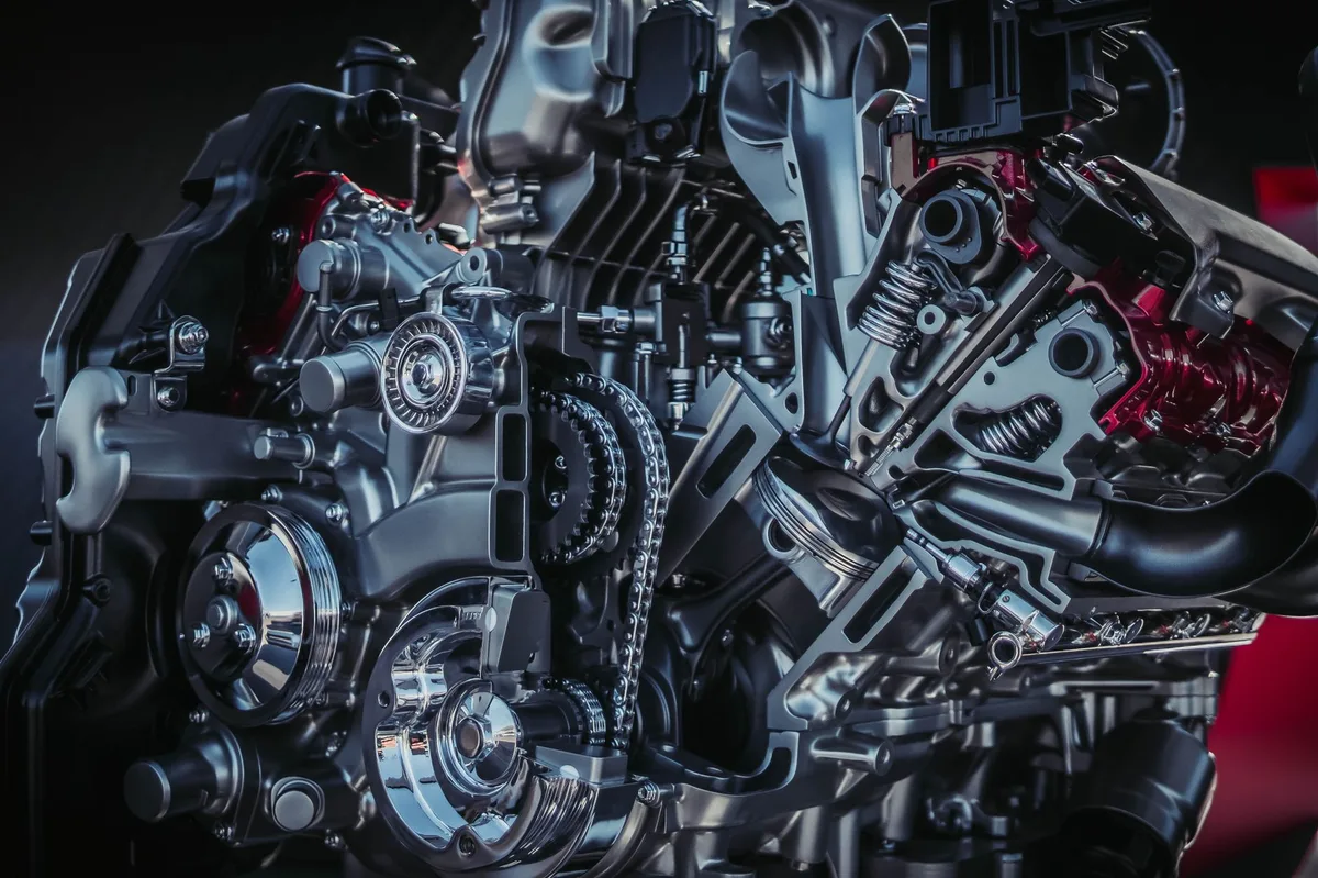 Detalhe de motor de carro mostrando componentes internos